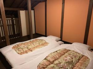 Posteľ alebo postele v izbe v ubytovaní 近江の町家 門
