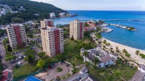 an aerial view of a city and the ocean at Sunset Two Bedroom Suite At Turtle Towers in Ocho Rios