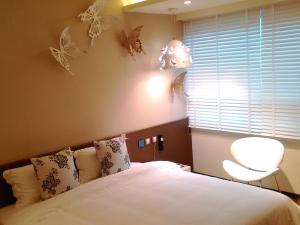 Letto o letti in una camera di Walker Hotel. Ximen