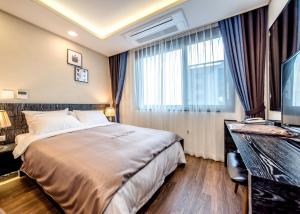 Postel nebo postele na pokoji v ubytování Seawater Spa Hotel Coza
