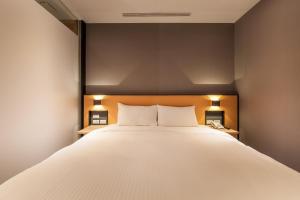 Letto o letti in una camera di Walker-Taoyuan