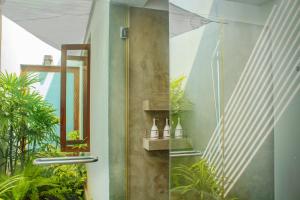 A garden outside Ubuntu Beach Villas by Reveal