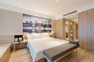 Posteľ alebo postele v izbe v ubytovaní Atour Hotel (Nanjing Xingang Development Area)