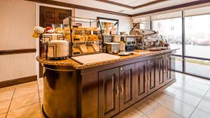 a kitchen with a counter with food on it at Best Western Dulles Airport Inn in Sterling