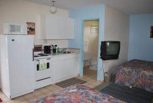 Kuchyň nebo kuchyňský kout v ubytování Sunset Motel