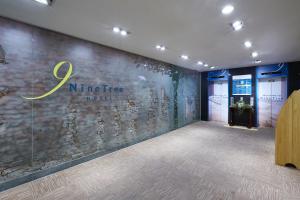 a lobby with a nine fire sign on a wall at Nine Tree Hotel Myeongdong in Seoul