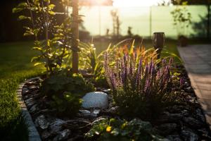 A garden outside Guest House Privat Pod Lesom