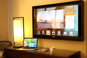 TV a/nebo společenská místnost v ubytování SSAW Boutique Hotel Shanghai Yilin