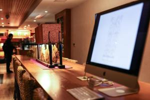 TV a/nebo společenská místnost v ubytování SSAW Boutique Hotel Shanghai Yilin