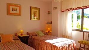 Postel nebo postele na pokoji v ubytování Villa Adelaida + 36 fotografií