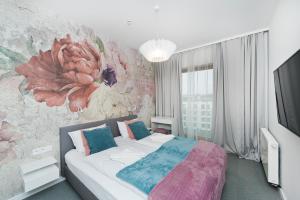 En eller flere senger på et rom på Apartament Sun & Snow Premium w Novum