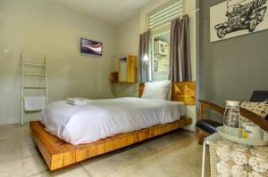 Ένα ή περισσότερα κρεβάτια σε δωμάτιο στο Jeng Tini Guest House