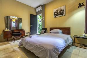 Ένα ή περισσότερα κρεβάτια σε δωμάτιο στο Jeng Tini Guest House