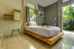 Ένα ή περισσότερα κρεβάτια σε δωμάτιο στο Jeng Tini Guest House