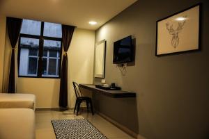 TV a/nebo společenská místnost v ubytování Mars Hotel + 19 fotografií