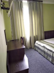 Postel nebo postele na pokoji v ubytování 12 Months Mini Hotel