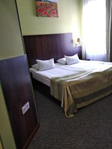 Postel nebo postele na pokoji v ubytování 12 Months Mini Hotel