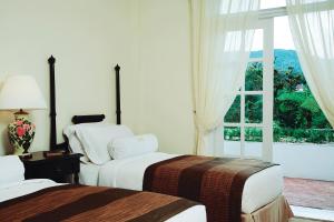 Llit o llits en una habitació de Cameron Highlands Resort - Small Luxury Hotels of the World