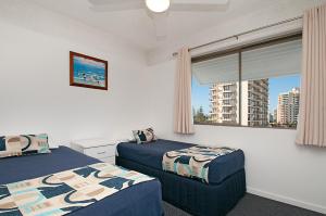 Bellardoo Holiday Apartments tesisinde bir odada yatak veya yataklar