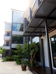 an external view of a building with a building at House 945 in Khon Kaen