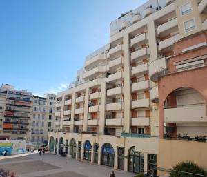 a large apartment building in a city at Alery apartment with terrace AC wifi 7th floor a few meters from the sea by Affitto-Nizza in Nice