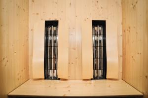 two tall windows in a room with a wooden floor at Bergruh Steeg in Steeg