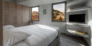 Posteľ alebo postele v izbe v ubytovaní Fos Residential Apartments