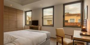 Posteľ alebo postele v izbe v ubytovaní Fos Residential Apartments
