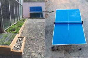 a blue board sitting outside of a building at Maison CAILLE in Embrun +53 photos