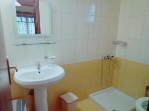 a white bathroom with a sink and a shower at Evridiki in Zagora +55 photos