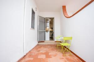 a hallway with a table and chairs in a room at Sunset Holiday House in Torre Lapillo +17 photos
