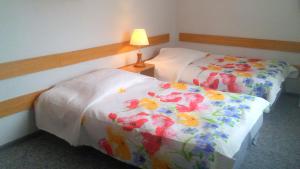 Łóżko lub łóżka w pokoju w obiekcie Willa "Zimowit" w Wiśle