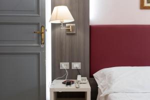 Posteľ alebo postele v izbe v ubytovaní Hotel Il Giardino