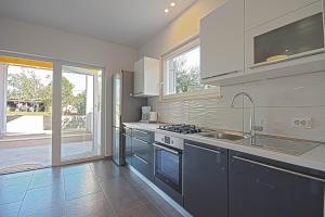 Kuchyň nebo kuchyňský kout v ubytování Apartman Topolino