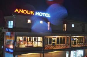 a hotel with a sign on the side of it at Anouk Hotel in Antananarivo