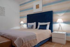 Ένα ή περισσότερα κρεβάτια σε δωμάτιο στο Stunning Caravelas Apartment +23 φωτογραφίες