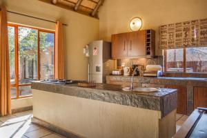 a kitchen with a counter with a sink in it at Warthogs Rest in Hoedspruit