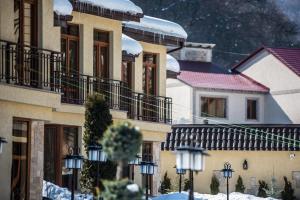 a group of buildings with snow on them at Elegant Hotel & Resort in Tsaghkadzor