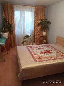 מיטה או מיטות בחדר ב-Apartments na Gvardeyskom