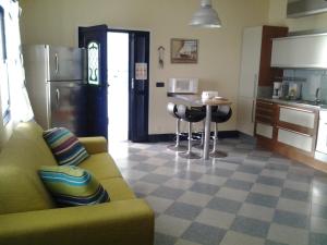 a living room with a couch and a kitchen at Azores Residence in Pesqueiro +22 photos