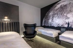 Postel nebo postele na pokoji v ubytování Hotel Grand