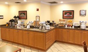 a food counter in a restaurant with a counter at Roadstar Hotel Zephyrhills in Zephyrhills