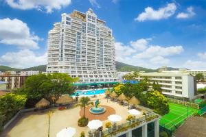 a large building with a pool and a resort at Andaman Sea View Apartment - Patong Beach in Patong Beach