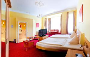Postel nebo postele na pokoji v ubytování Hotel Vivaldi Berlin am Kurfürstendamm + 8 fotografií