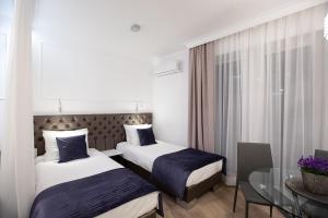 Posteľ alebo postele v izbe v ubytovaní Glamour Centrum
