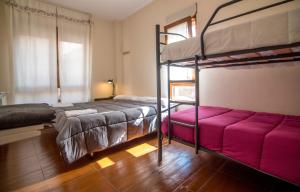Postel nebo postele na pokoji v ubytování Albergue de Prioro