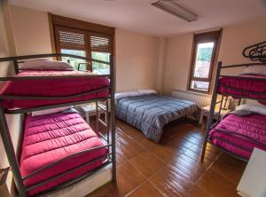 Postel nebo postele na pokoji v ubytování Albergue de Prioro