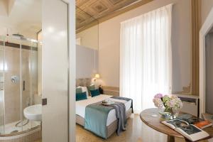 A bathroom at Boutique Hotel Atelier '800 Még 32 kép