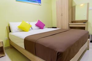 Postel nebo postele na pokoji v ubytování Tourist Inn