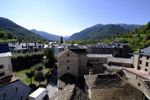 an aerial view of a town with mountains in the background at Hotel Pradas Ordesa in Broto